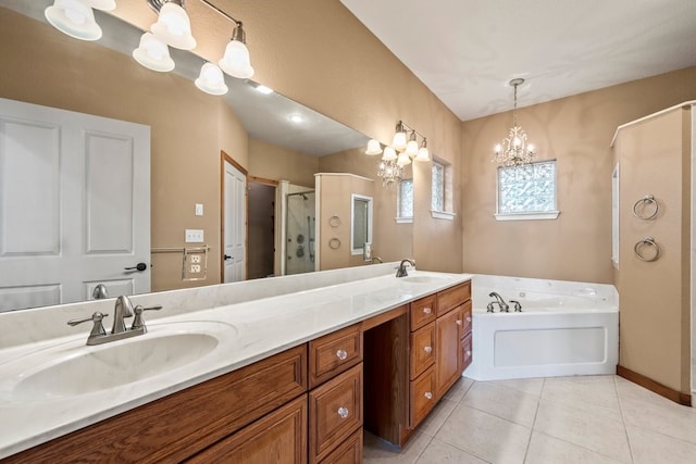 bathroom with double vanity, a stall shower, tile patterned floors, a garden tub, and a sink