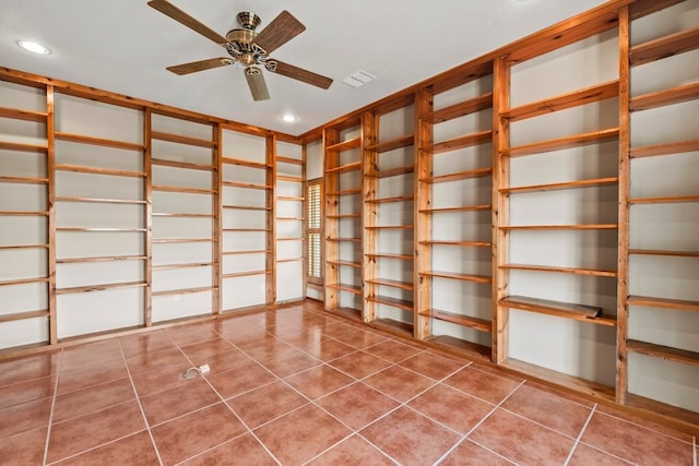 interior space featuring visible vents and ceiling fan