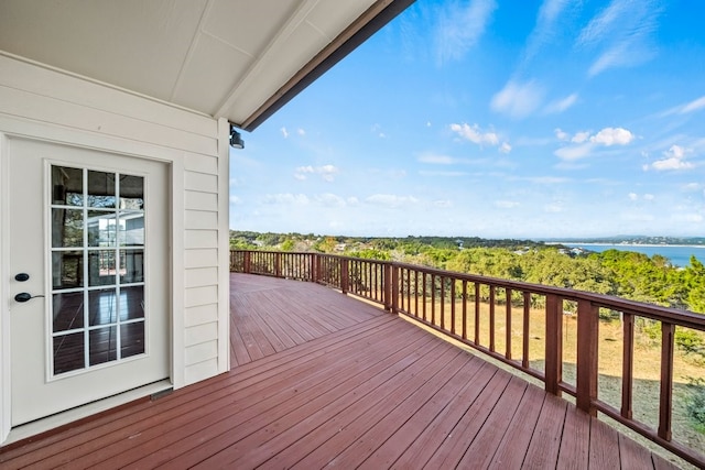 wooden deck featuring a water view