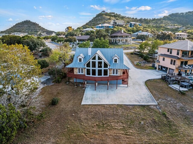 birds eye view of property featuring a mountain view