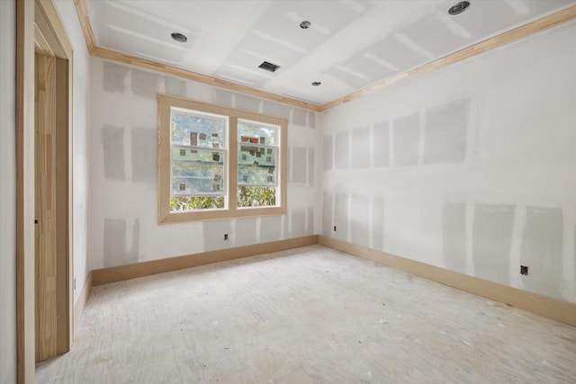 unfurnished room with crown molding