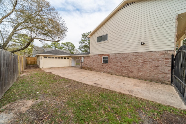 view of side of property featuring a garage