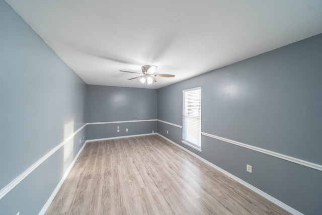 empty room featuring light hardwood / wood-style floors and ceiling fan