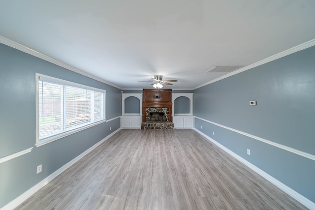 unfurnished living room with crown molding, ceiling fan, and light wood-type flooring