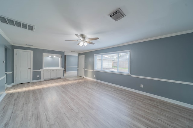 interior space featuring light hardwood / wood-style floors, ceiling fan, and ornamental molding