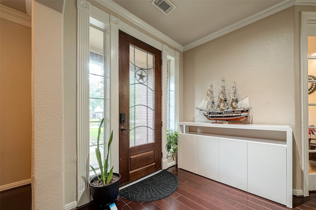 entryway with ornamental molding and dark hardwood / wood-style flooring