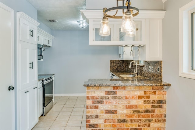 kitchen with white cabinetry, sink, and stainless steel appliances