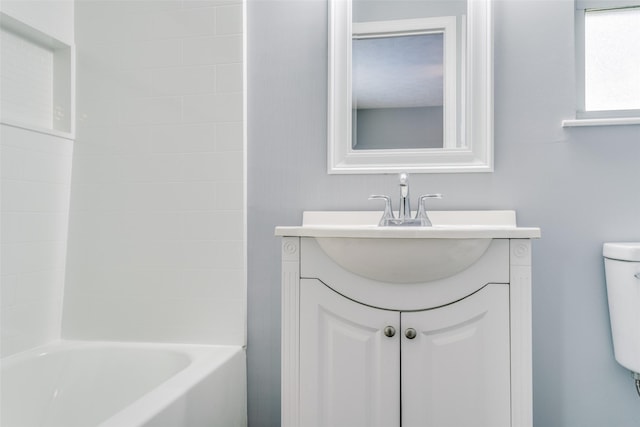 full bathroom featuring vanity, shower / bathtub combination, and toilet