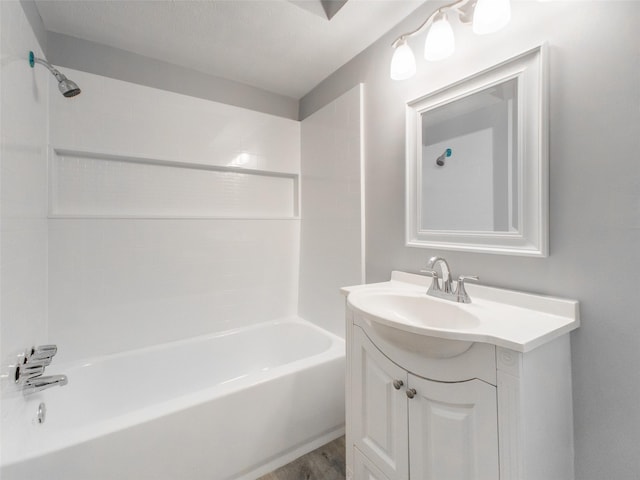 bathroom with vanity, wood-type flooring, and shower / tub combination