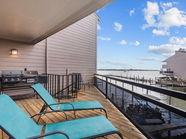 balcony featuring a grill and a water view