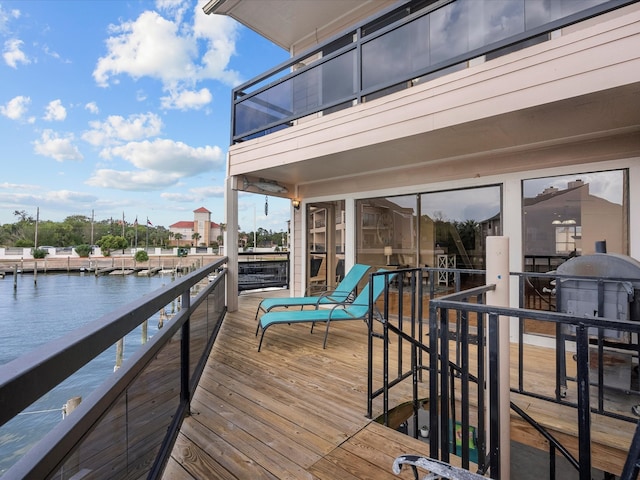 deck featuring a water view