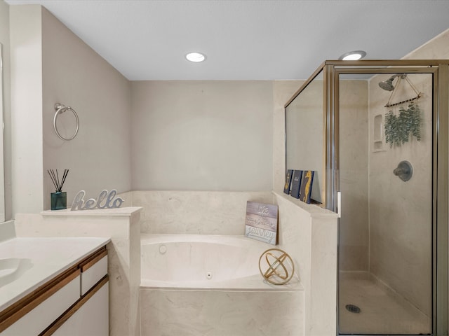 bathroom featuring vanity and separate shower and tub