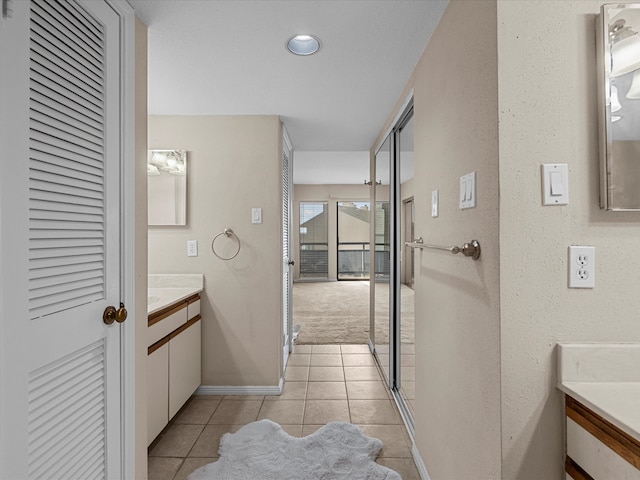 bathroom with vanity and tile patterned floors