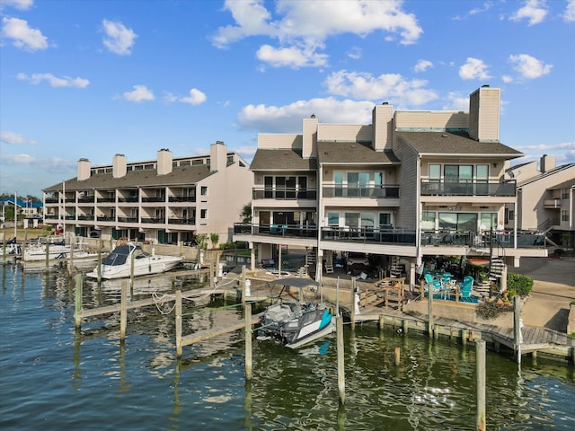 exterior space with a water view and a balcony