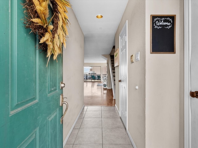 hallway with light tile patterned floors