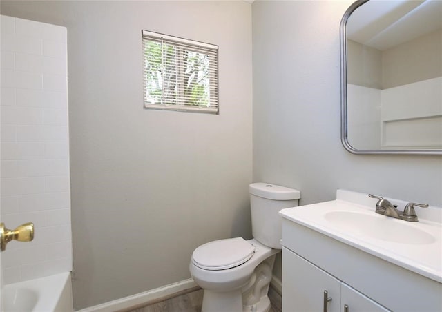 full bathroom with vanity, wood-type flooring, tub / shower combination, and toilet