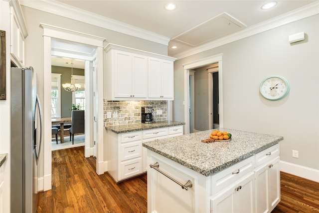 kitchen featuring a kitchen island, white cabinetry, light stone countertops, stainless steel fridge with ice dispenser, and dark hardwood / wood-style flooring