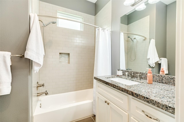 bathroom featuring vanity and shower / bath combo