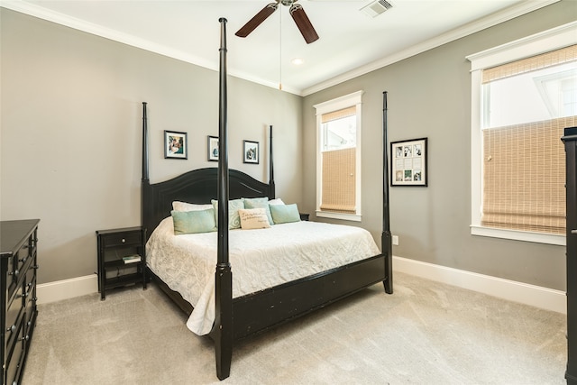 carpeted bedroom featuring ceiling fan and ornamental molding