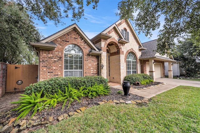 view of front of home with a garage and a front yard