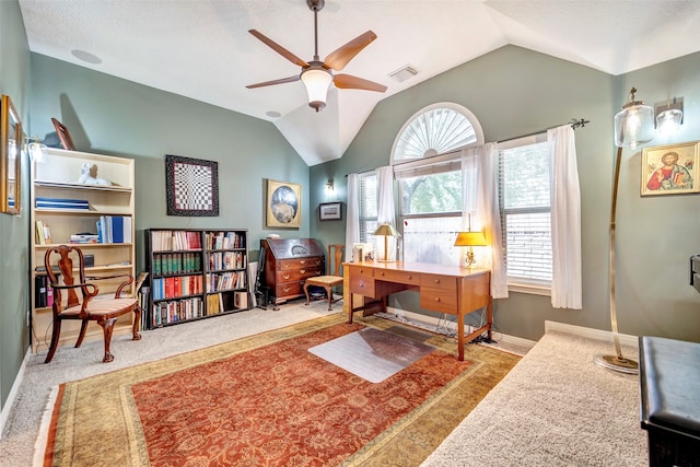 carpeted office space featuring a textured ceiling, ceiling fan, and vaulted ceiling