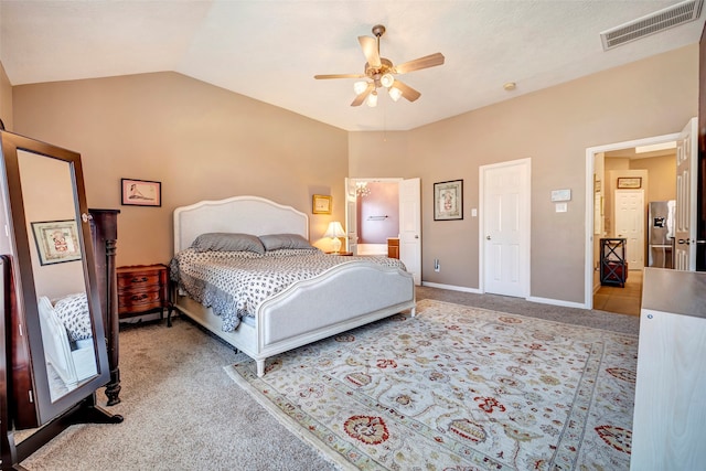 carpeted bedroom with stainless steel refrigerator with ice dispenser, ceiling fan, and lofted ceiling