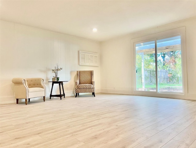 unfurnished room featuring baseboards and wood finished floors