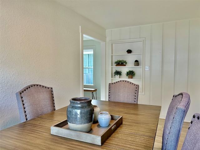 dining space featuring wood-type flooring