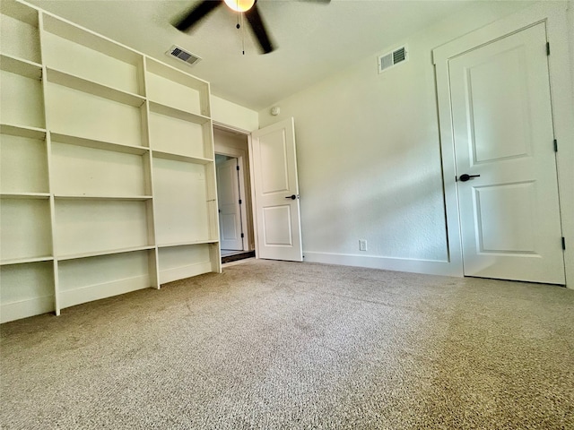 unfurnished bedroom with carpet floors and ceiling fan