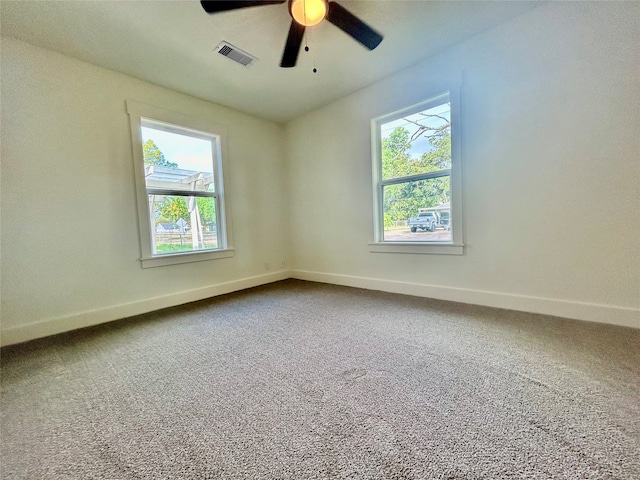 spare room with carpet floors and ceiling fan