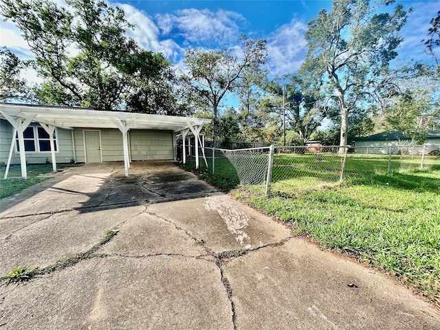 exterior space with a yard and a carport