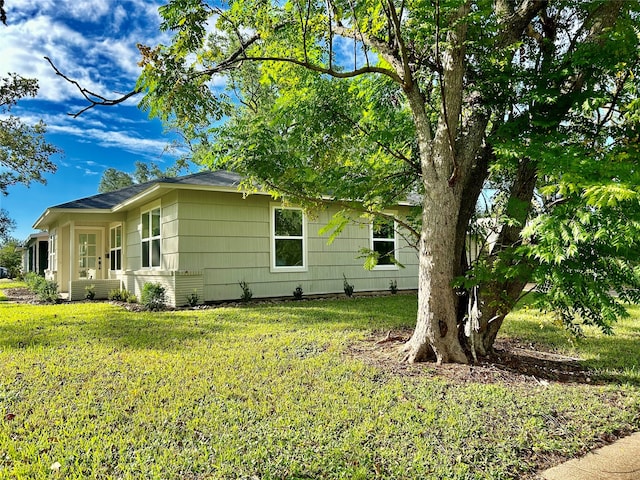 view of home's exterior featuring a lawn