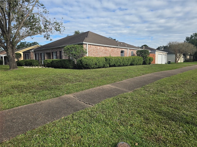 view of home's exterior with a yard and a garage