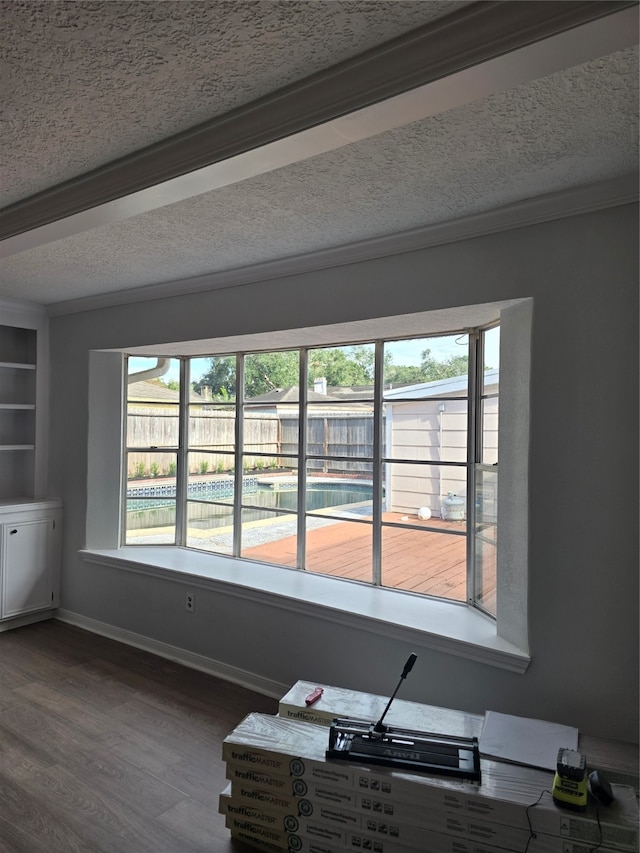 interior details featuring crown molding and hardwood / wood-style floors