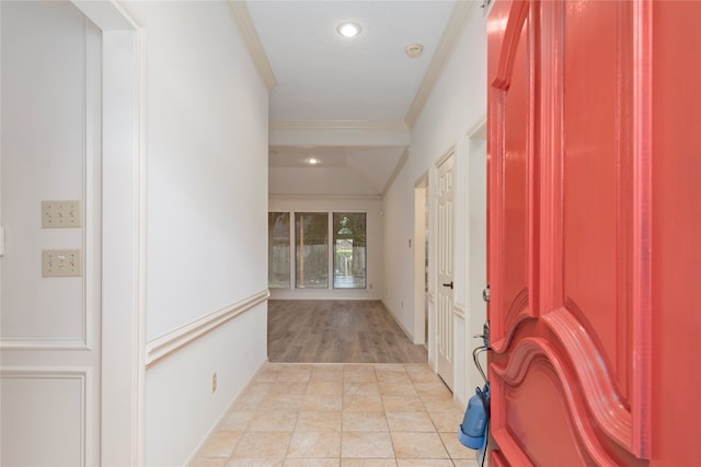 hallway featuring light hardwood / wood-style floors and crown molding