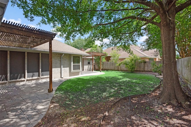 view of yard with a pergola and a patio area