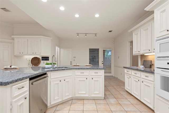 kitchen with white cabinetry, ornamental molding, sink, and white appliances