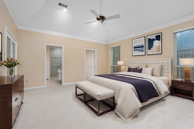 bedroom with crown molding, light colored carpet, ceiling fan, and ensuite bath