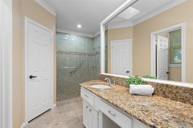 bathroom featuring a shower with door, tile patterned flooring, ornamental molding, a skylight, and vanity