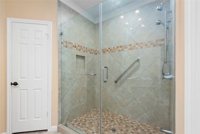 bathroom with a shower with shower door