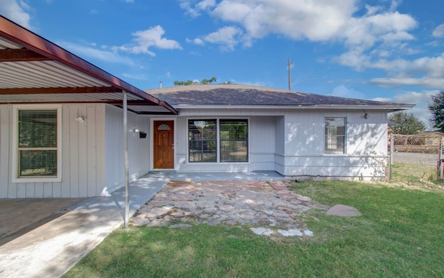 exterior space featuring a lawn and a patio