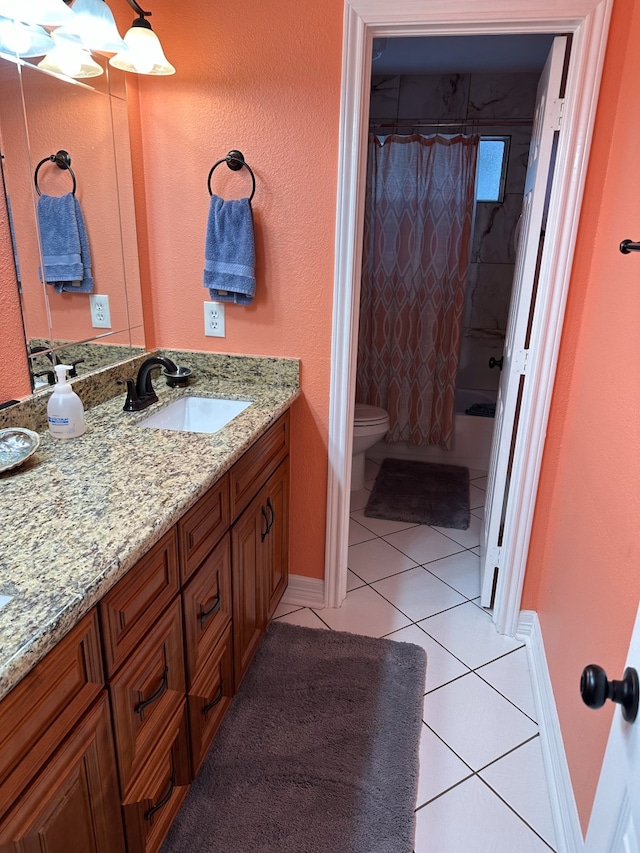 full bathroom featuring shower / bath combo with shower curtain, vanity, tile patterned floors, and toilet