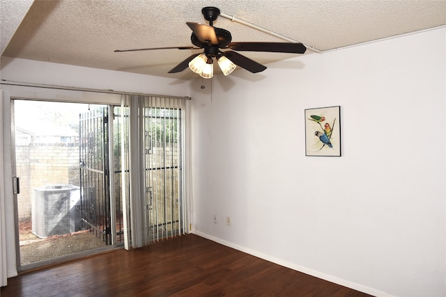 unfurnished room featuring ceiling fan, a textured ceiling, and dark hardwood / wood-style flooring