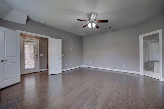 spare room with ceiling fan and dark hardwood / wood-style flooring