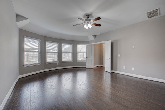 unfurnished room featuring dark wood-type flooring and ceiling fan