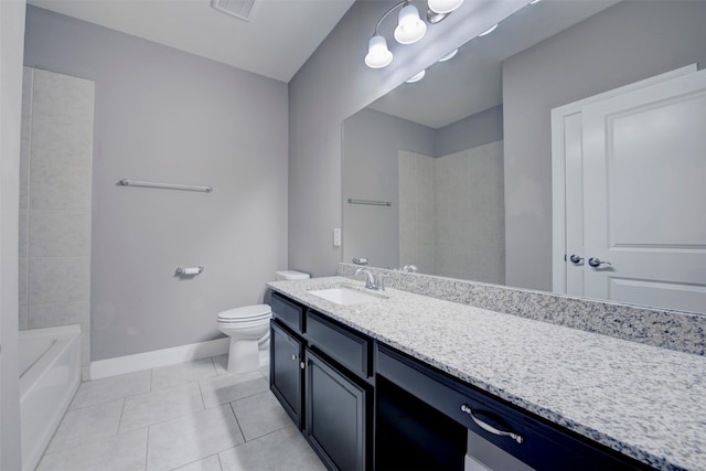 bathroom featuring toilet, vanity, and tile patterned floors