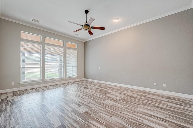 spare room featuring ceiling fan, crown molding, and light hardwood / wood-style flooring