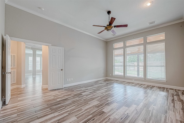 unfurnished room with ceiling fan, light wood-type flooring, and crown molding