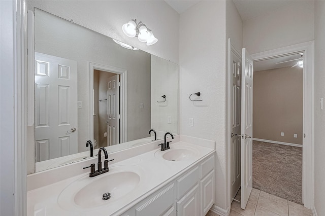 bathroom featuring tile patterned flooring and vanity