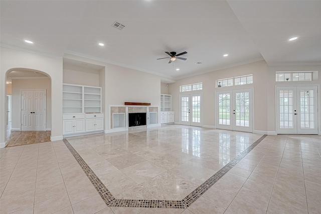 1810 Mccrary Rd, Richmond, TX 77406 - unfurnished living room featuring french doors, crown molding, baseboards, a ceiling fan, and built in features